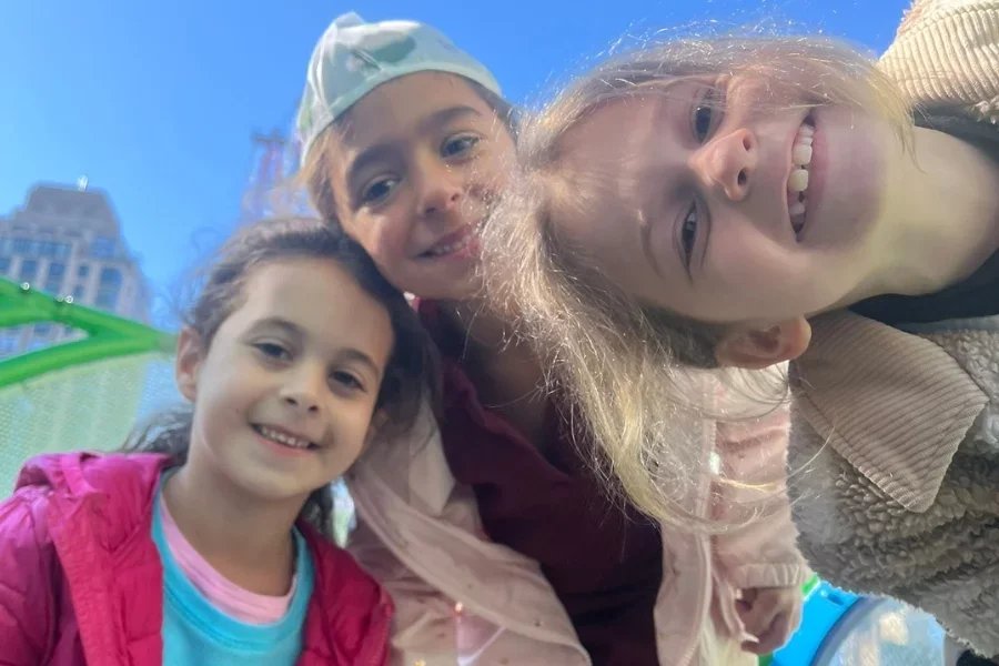 kids posing on rooftop playground