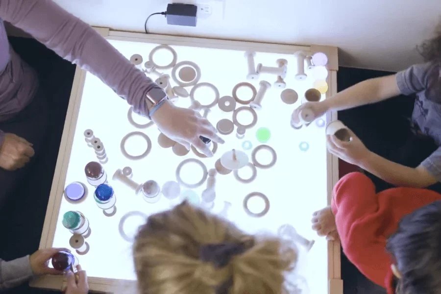 kids playing on a light table