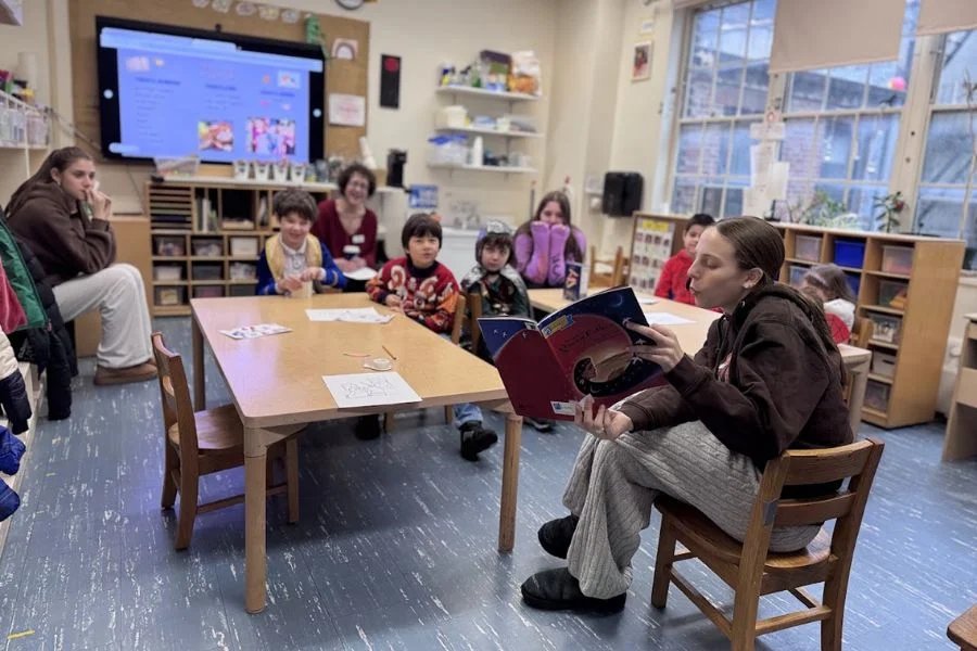 kids and teacher working with puppets