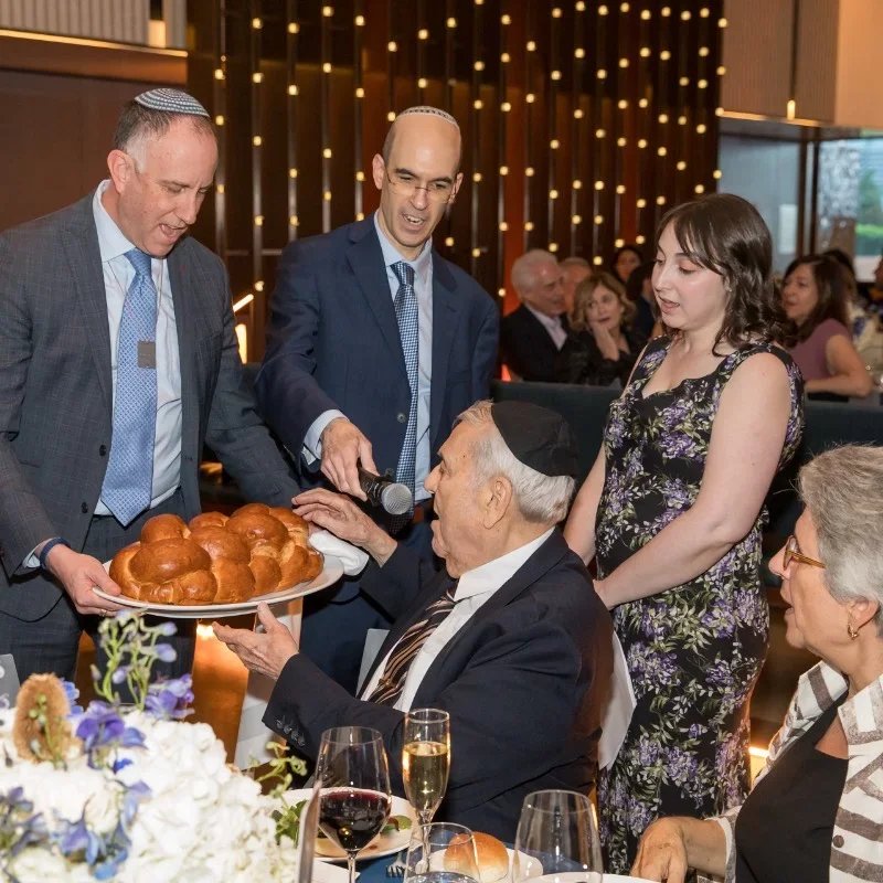 shaaray tefila clergy doing motzi at gala