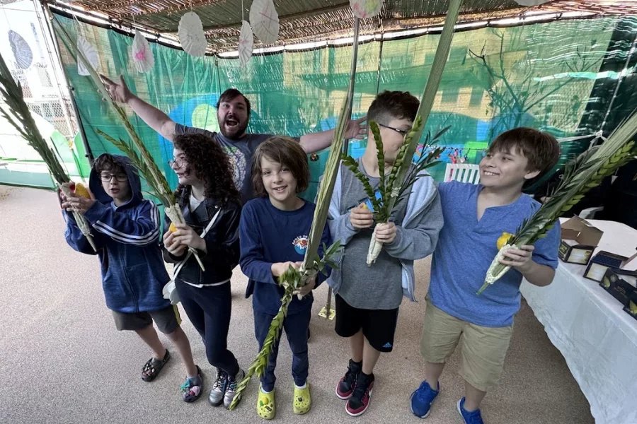 kids in a sukkah
