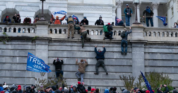 Rioters scale the Capitol on January 6
