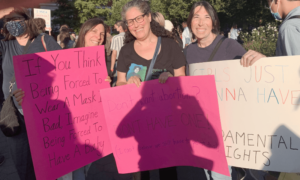 rabbi reines and shaaray tefila members holding signs at a reproductive rights march in 2021