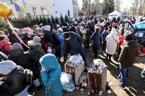 Refugees gather in front of the Ukrainian consulate in Warsaw, Poland March 10, 2022. Kuba Atys/Agencja Wyborcza.pl via REUTERS
